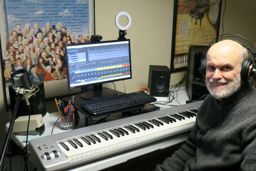 alt Stephen Demers, composer, in home studio with keyboard and recording equipment